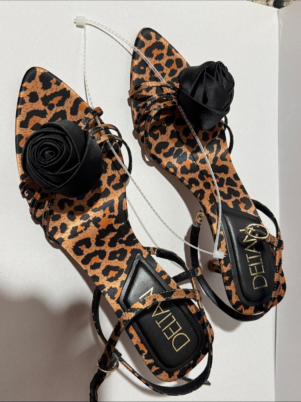 Deltas Leopard Print Slingback Sandals with Black Rosette. Leather sole